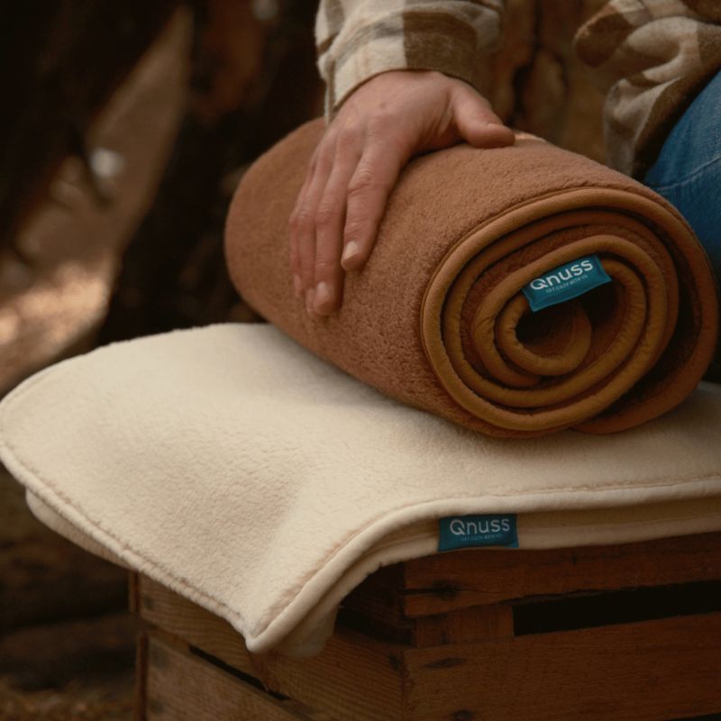warmtedeken Qnuss opgerold afgebeeld