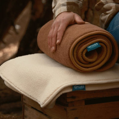 warmtedeken Qnuss opgerold afgebeeld