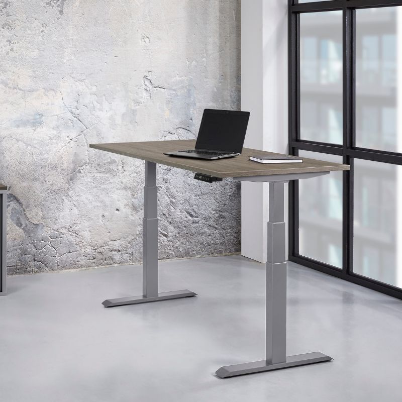 zit-sta bureau met laptop en boekje